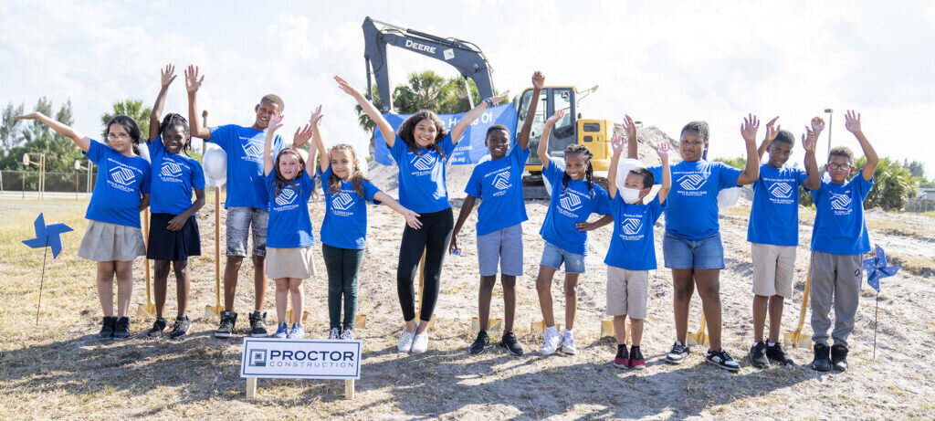 Group of kids in the Sturat Club wearing matching shirts celebrating at the groundbreaking of the new Greater Stuart Club