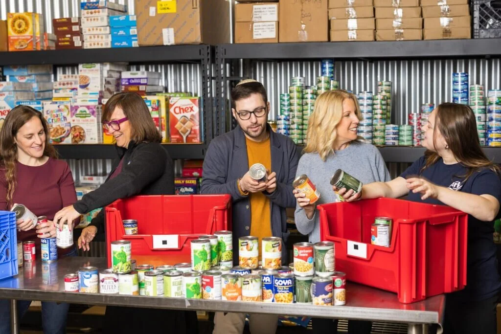 Food pantry volunteers sorting through donations