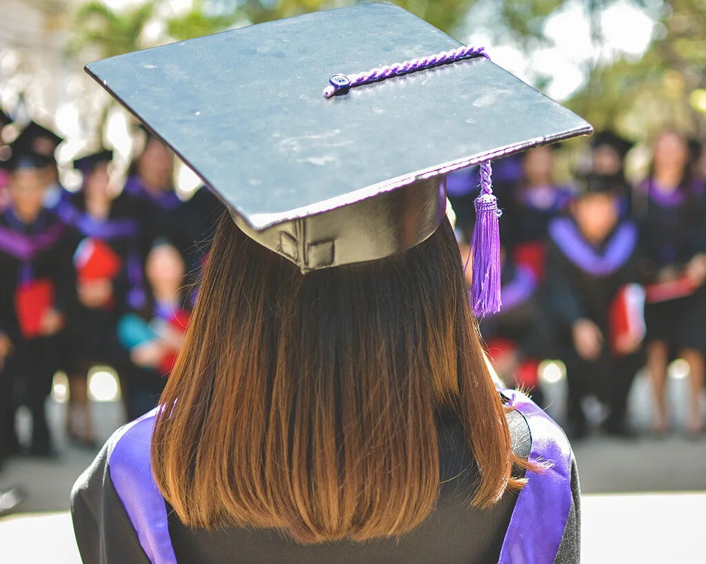 Girl in graduation gown and cap