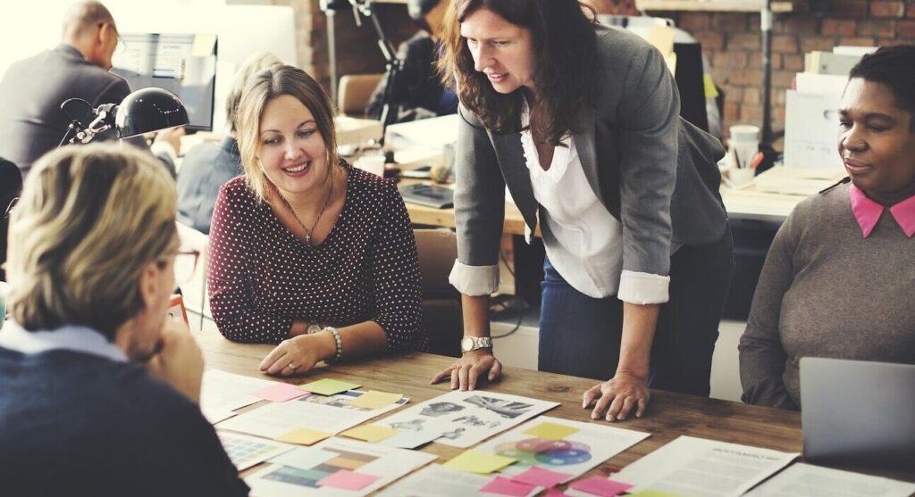 a group of women work together at a table